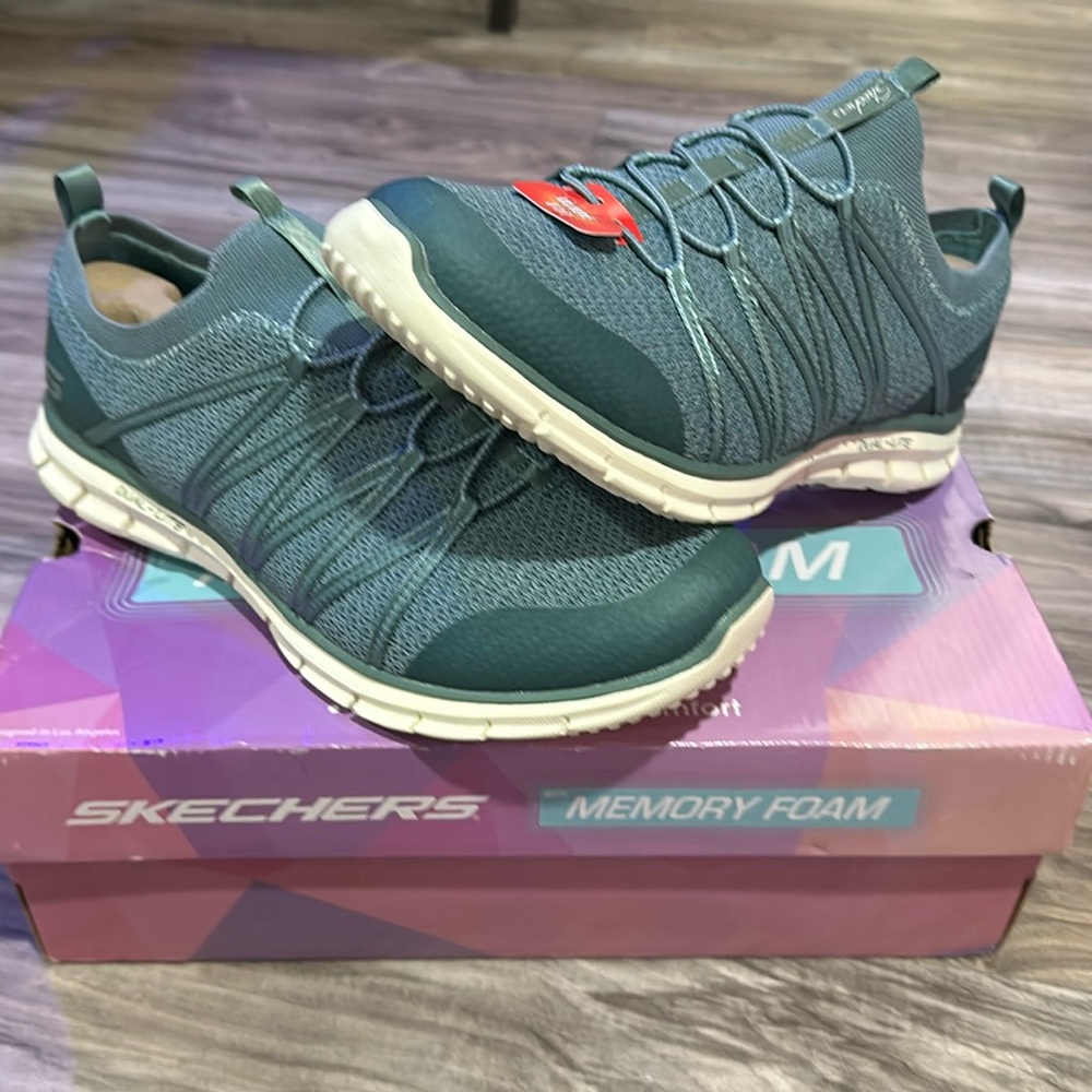 Skechers women’s slip on sneaker w/memory foam. Size 11wide. Sage green